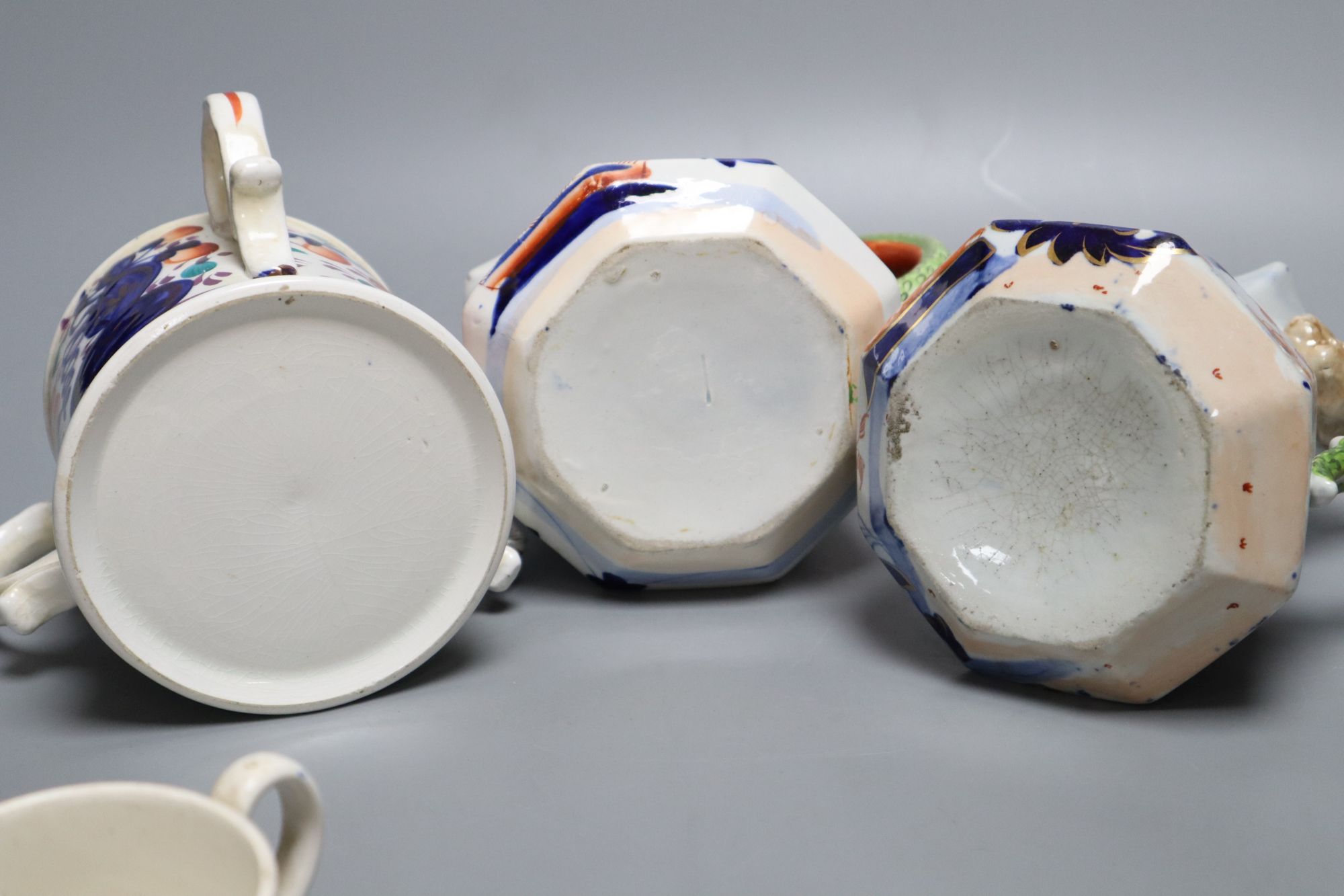 Eight pieces of Ironstone china including two jugs and a three handled cider mug